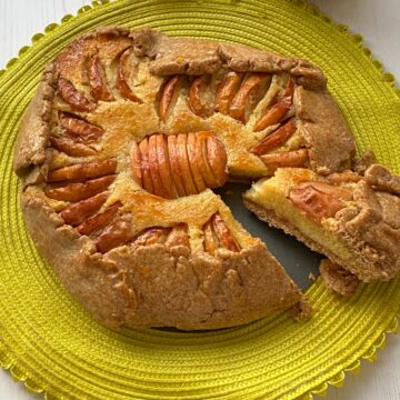 Apple and Frangipane Tart with a slice cut out.