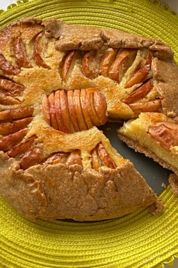 Apple and Frangipane Tart with a slice cut out.