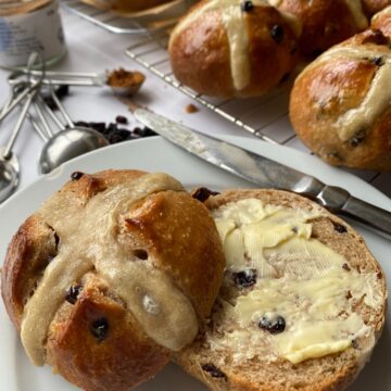 Sliced and buttered Hot Cross Bun.