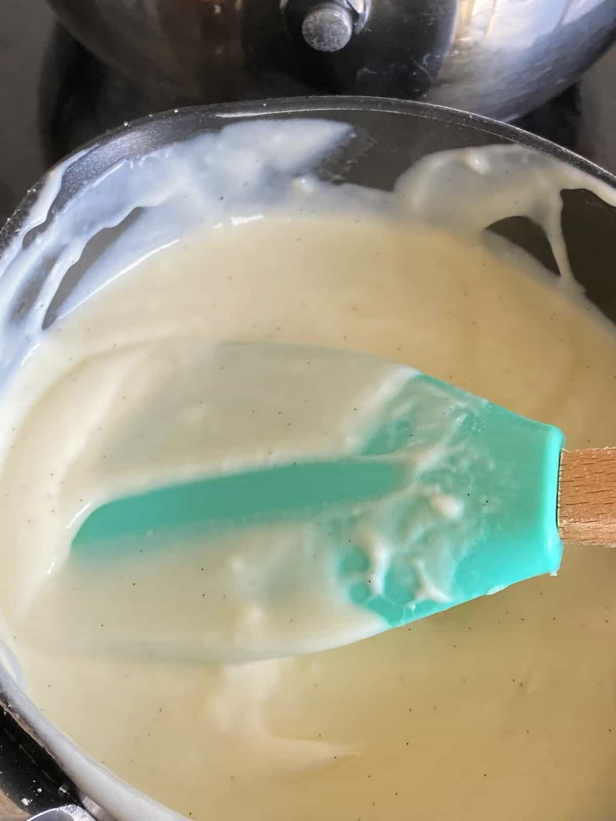 Stirring custard in a pan.